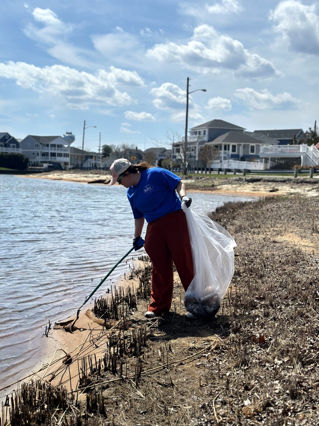 A Blitz Captain picking up litter from the bay.