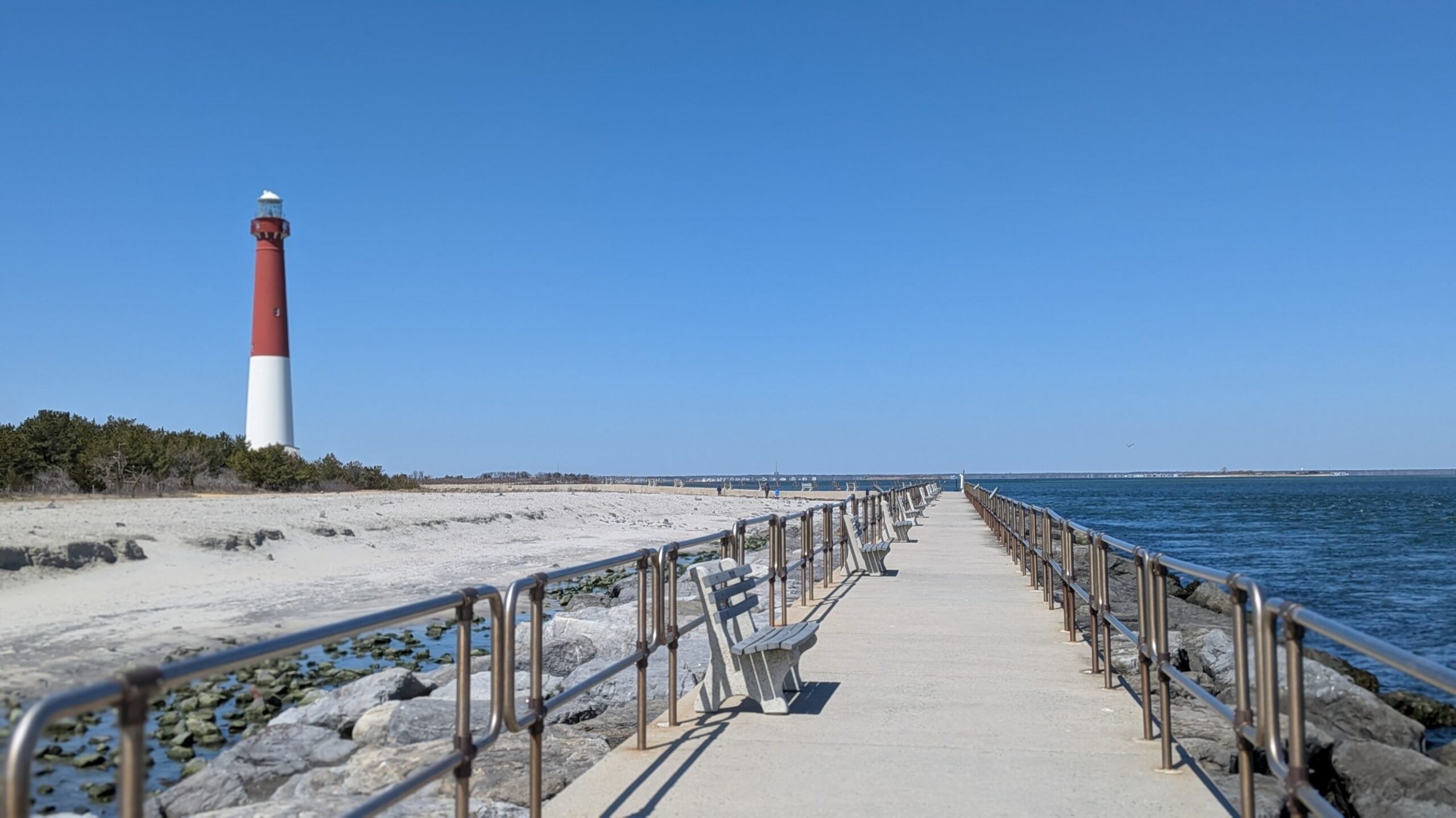 boardwalk with the lighthouse in the background